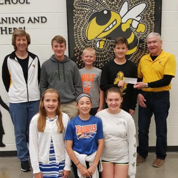 Destination Imagination receiving check from Alumni Assocation